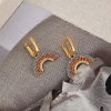 New fashionable micro-inlaid rainbow-shaped zircon brass 18K real gold electroplated earring buckles in the European and American ins style Application Scenario